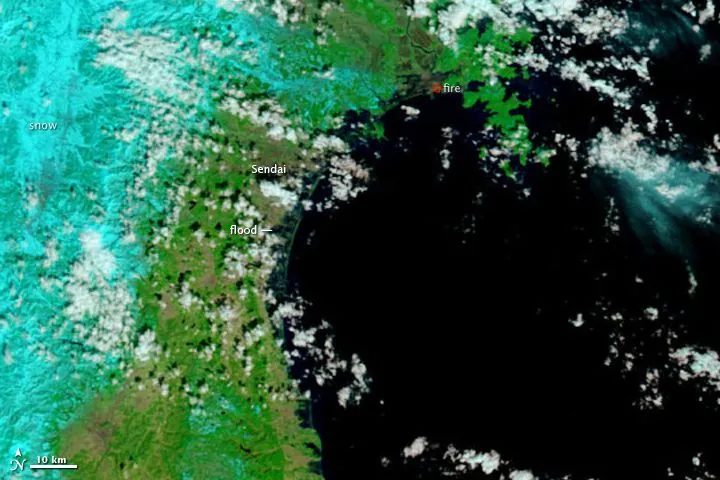Satellite image of Sendai, Japan, labelled to show flooding, snow and a fire after the 2011 tsunami.