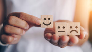 DeeLab, NLP Labeling - Happy, neutral and sad face icon on wood cube.