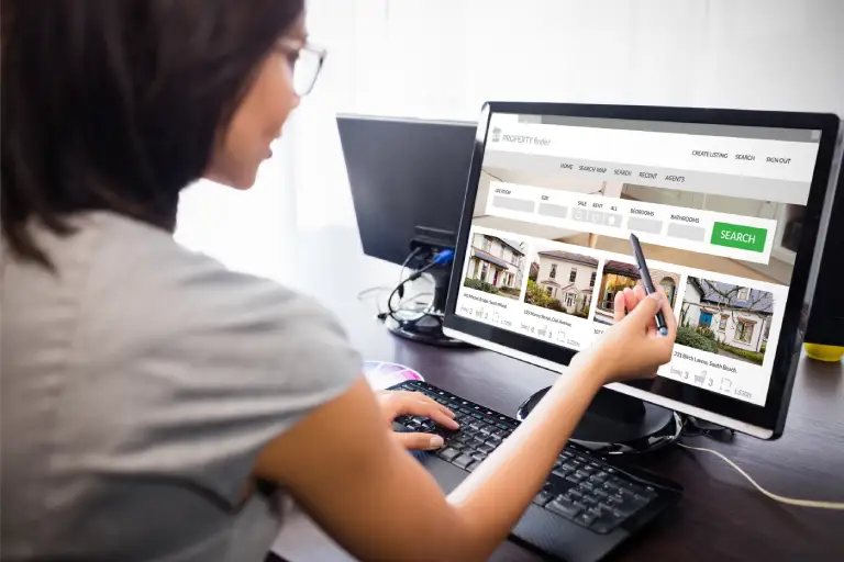 Woman conducting in-depth property market research on her laptop, showcasing DeeLab's comprehensive web research services that provide tailored insights and accurate data analysis to help clients make informed decisions.