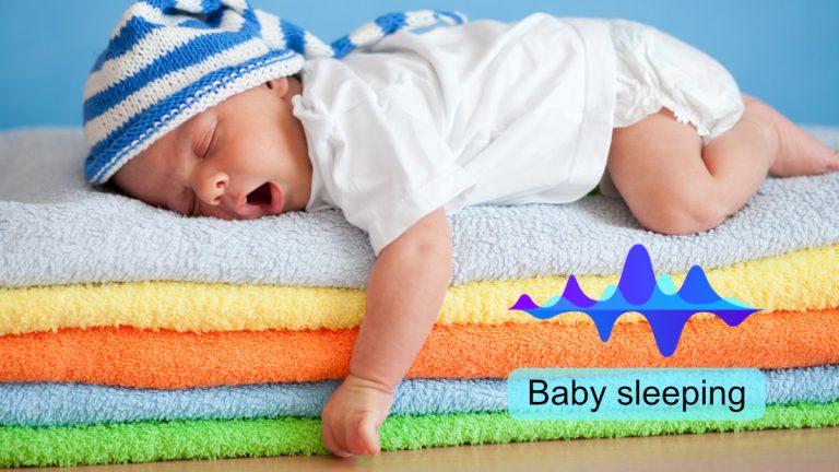 Yawning sleeping baby on colorful towels stack Sleeping baby with sound wave and the label “Baby sleeping” overlayed, illustrating labeled audio data.